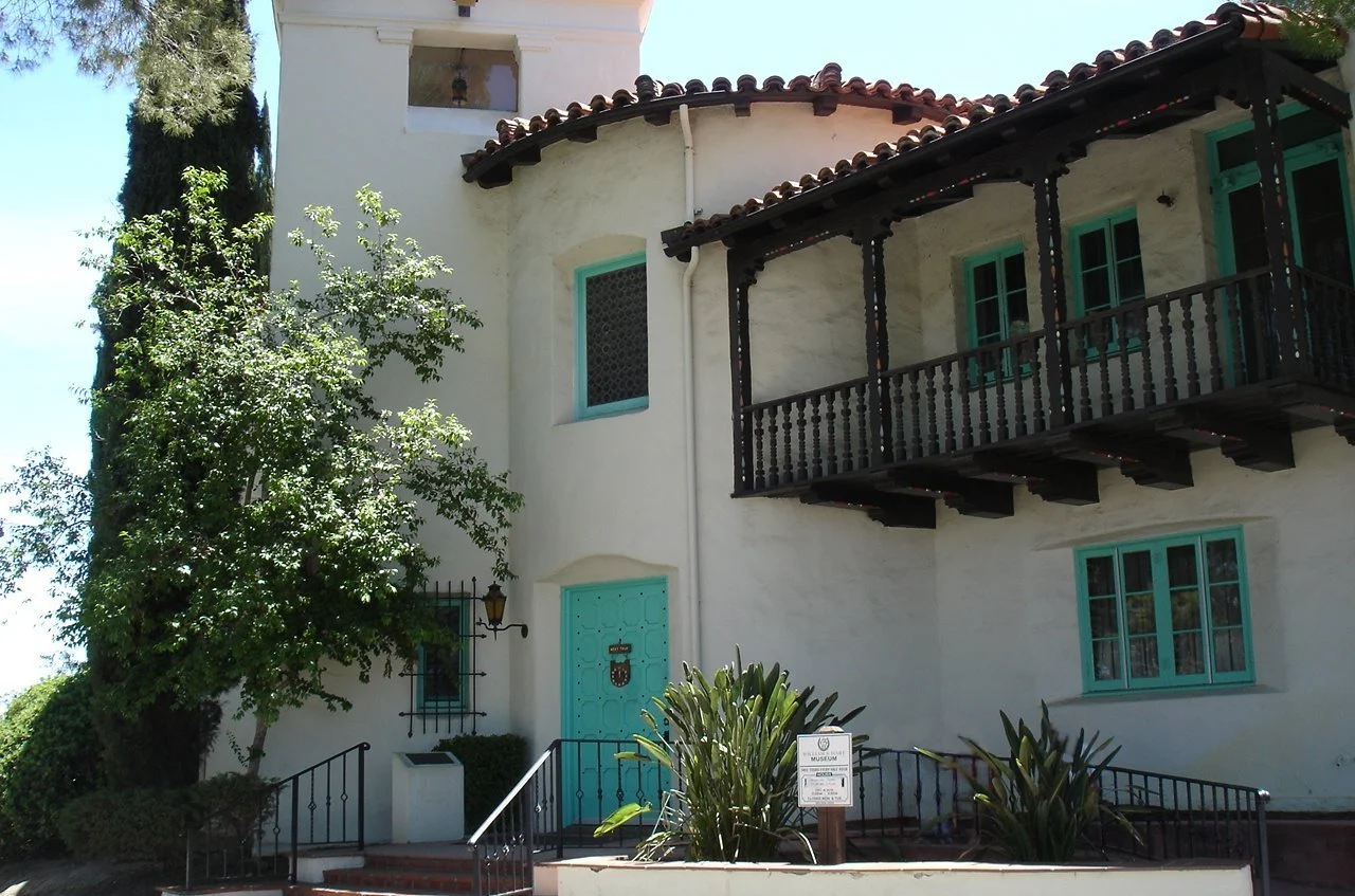 Balcony, tiled roof and turquoise doors of the historic William S. Hart house